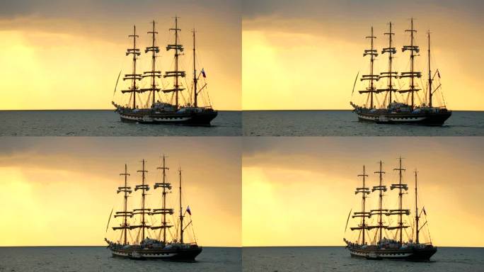 日落时古代帆船的轮廓