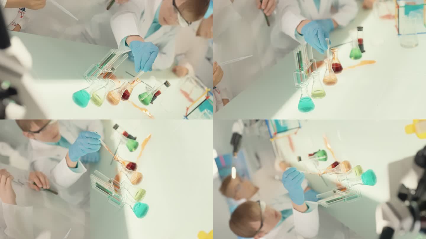 孩子们在实验室里做科学实验。用吸管倒入多色液体。闭合