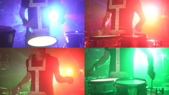 背景为霓虹灯的男性打鼓套件特写镜头