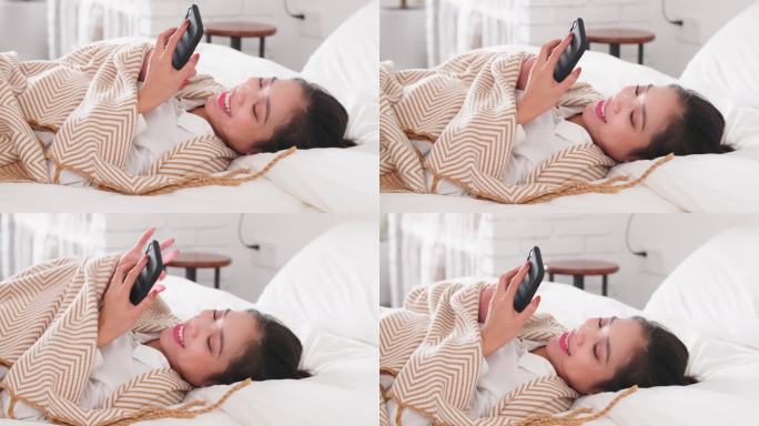 美女躺在床上刷手机网络追剧