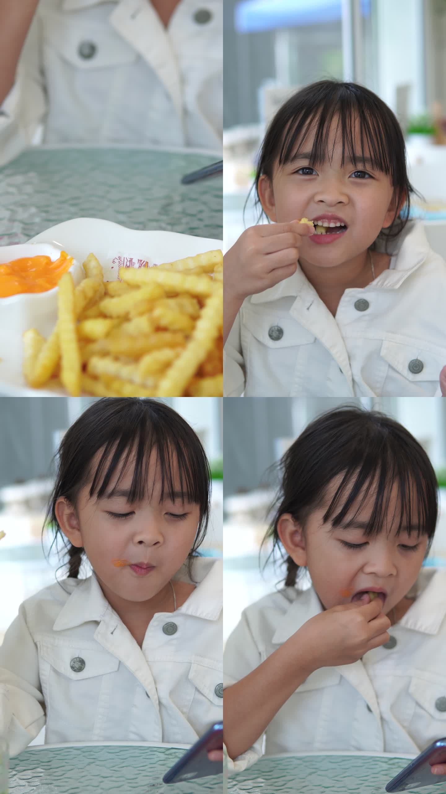 画像小女孩在餐厅吃薯条和打电话
