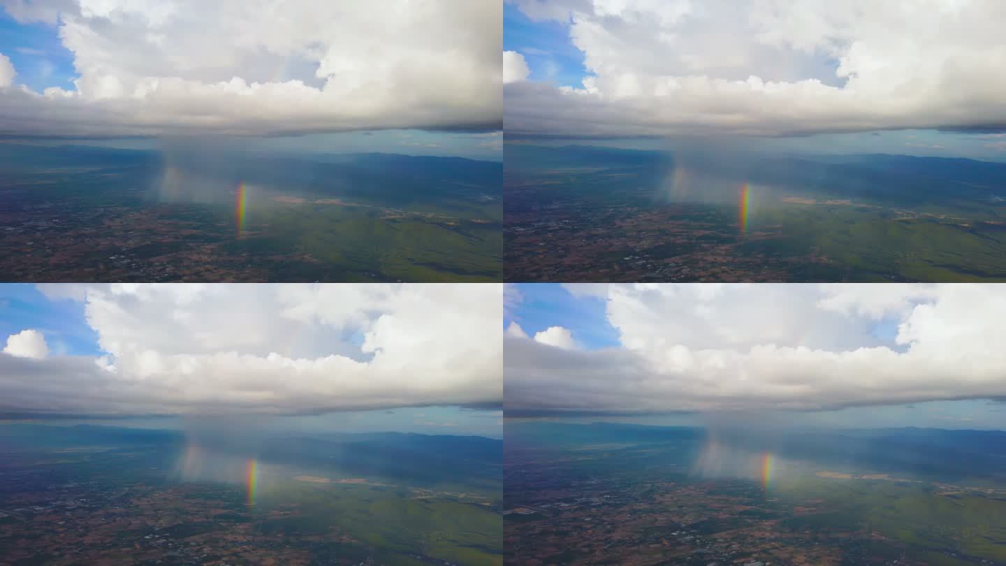 在云天和彩虹的飞机上从窗口观看风景
