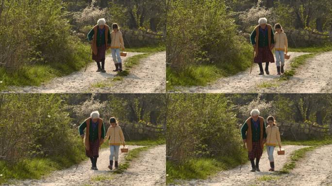 老年妇女和儿童走在路上。握手。