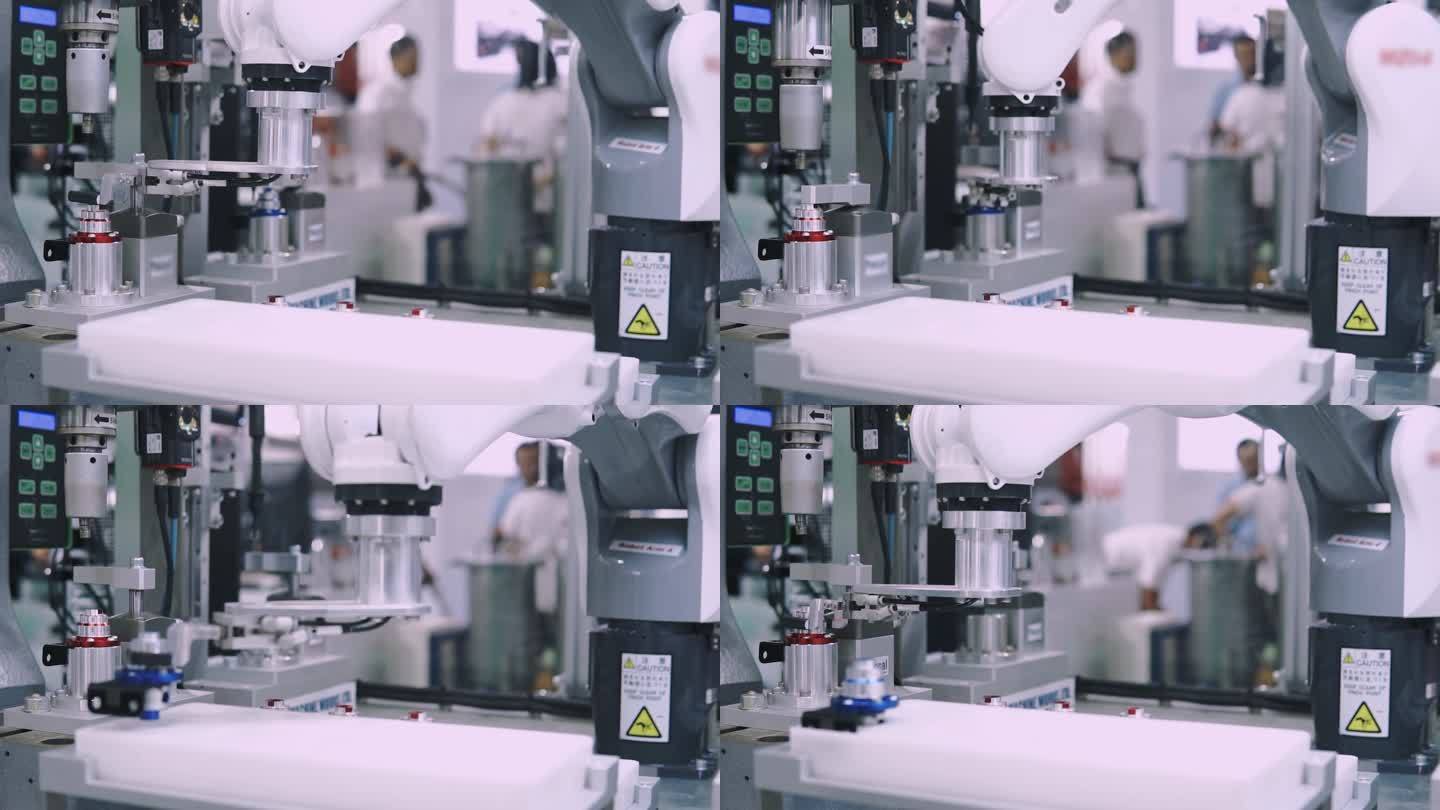 在工厂的工作站上运行的机器人机器制造部件。
