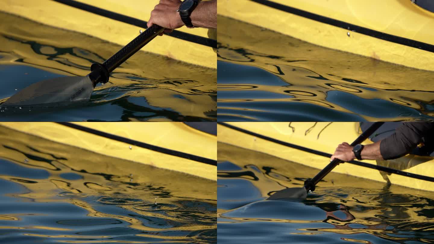 一名男子在湖上划独木舟的详细照片