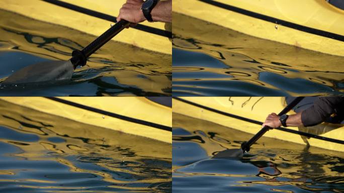 一名男子在湖上划独木舟的详细照片