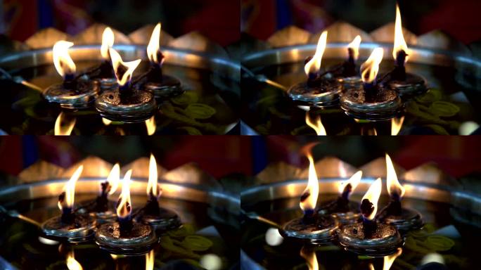 慢动作泰国寺庙中的火焰油灯。