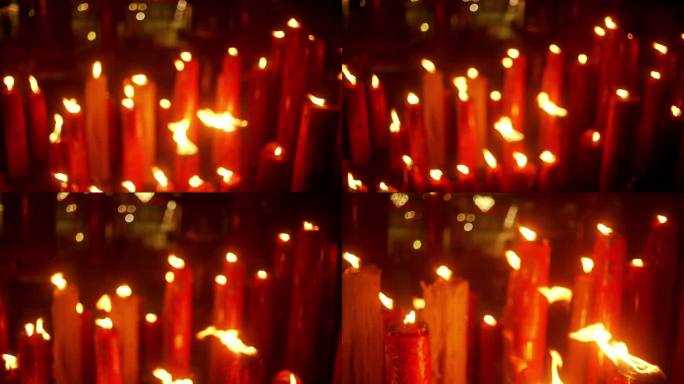 中国寺庙蜡烛特写红色烧香烛火虚化朦胧