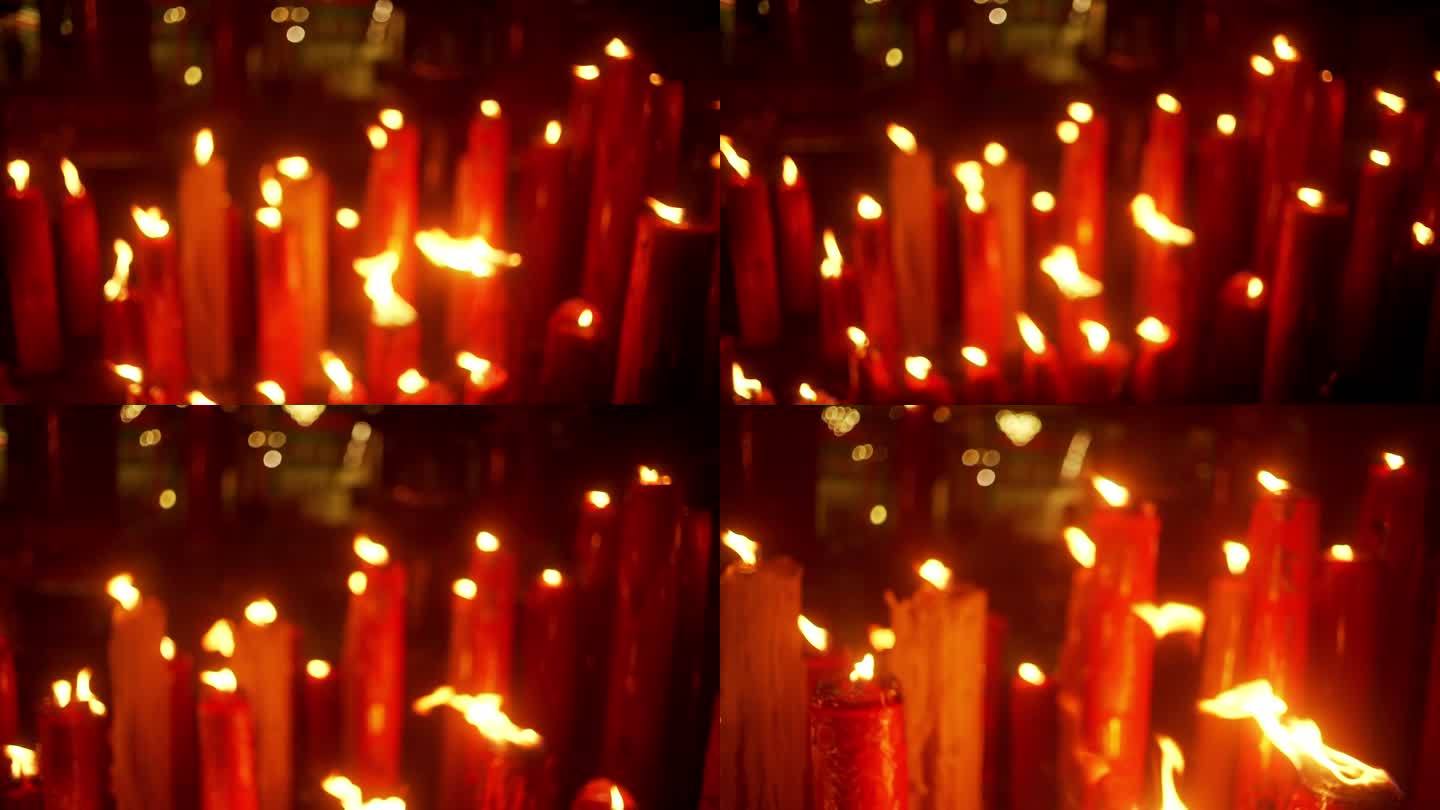 中国寺庙蜡烛特写红色烧香烛火虚化朦胧