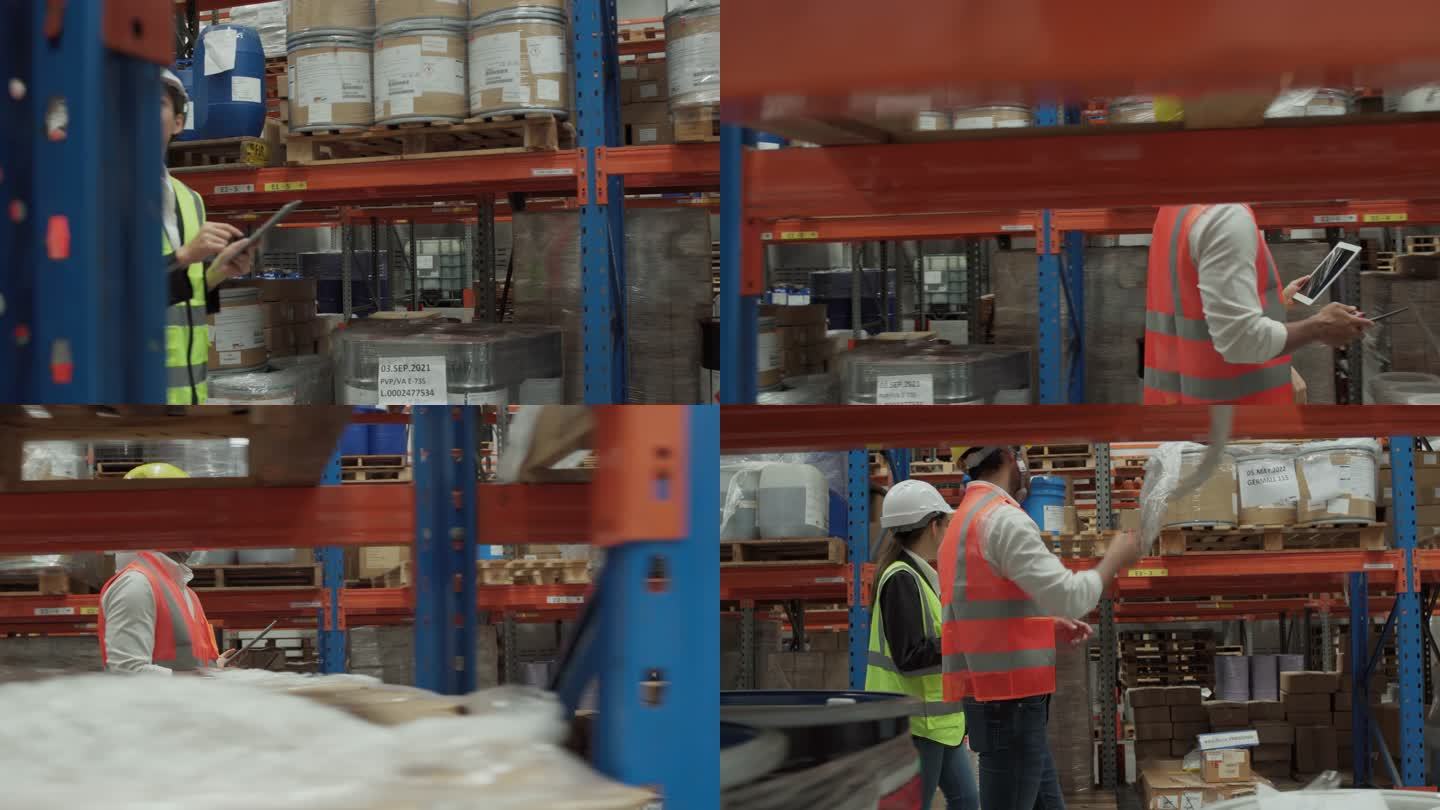 亚洲仓库工人男女在仓库使用数字平板电脑与白色安全帽进行讨论。仓库员工在配送仓库检查库存。