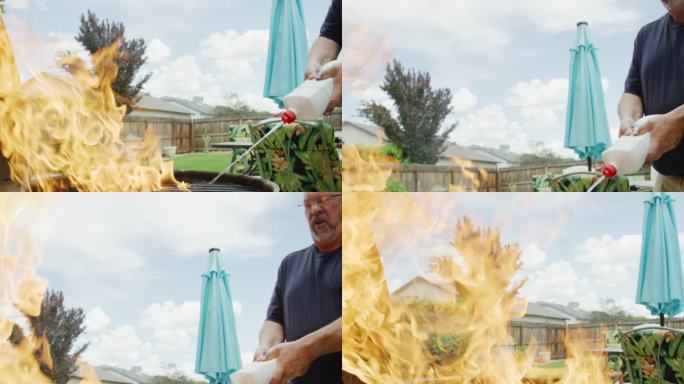 一名五十多岁的白人男子在多云的天空下，将液体打火机液体从塑料瓶喷到一个室外烧烤架上，烧烤架在住宅后院