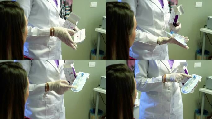 年轻女性美容师在诊所库存视频中从安瓿中回收液体
