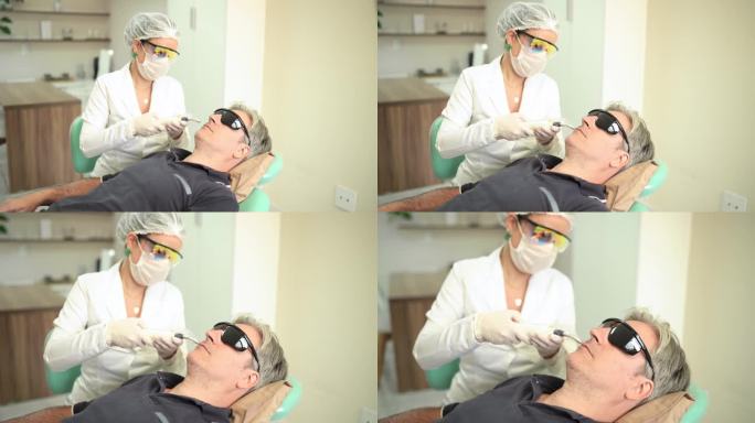 美容师在一个成熟男人的脸上进行胶原蛋白治疗
