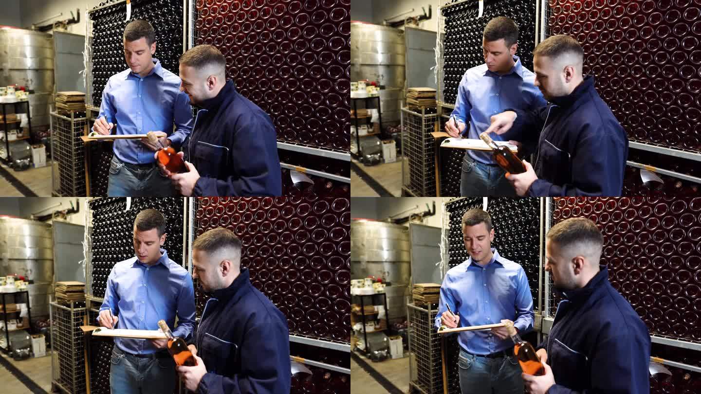 酒厂老板和质量控制专家检查酒窖中的葡萄酒质量