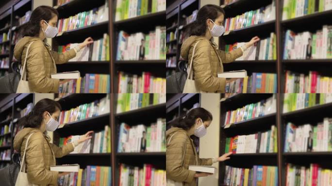 新冠肺炎流行期间，一名妇女在书店挑选新书