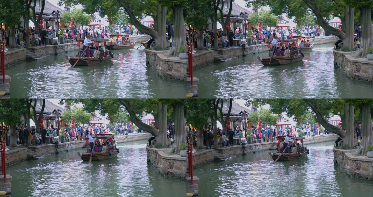 8K实拍古镇人流意境背影水中划桨游客玩耍