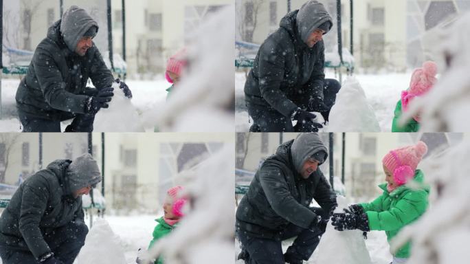 爸爸和他的孩子们在后院玩雪球，爸爸和他的女儿们在外面玩雪球。爸爸和女儿们在堆雪人，两个姐妹在雪地里玩