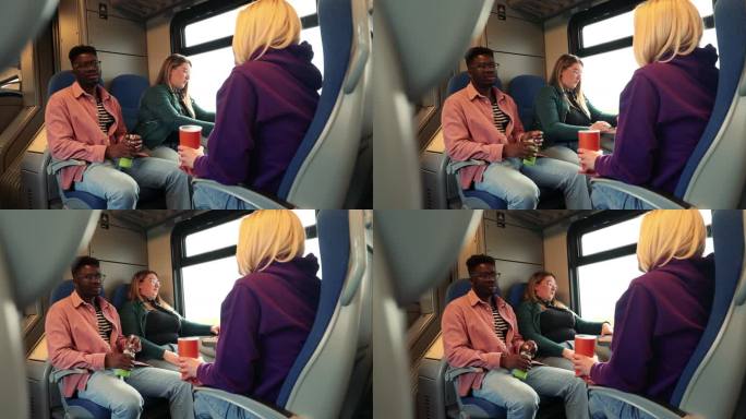 两个朋友坐公共汽车旅行时聊天，而他们的朋友拿着一本书读。
