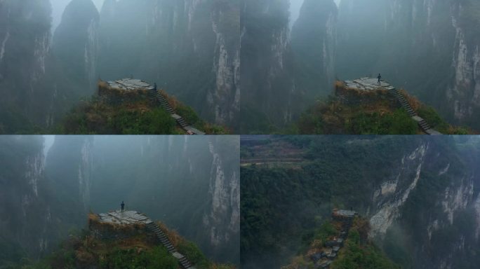 航拍一个人站在德夯大峡谷问天台上