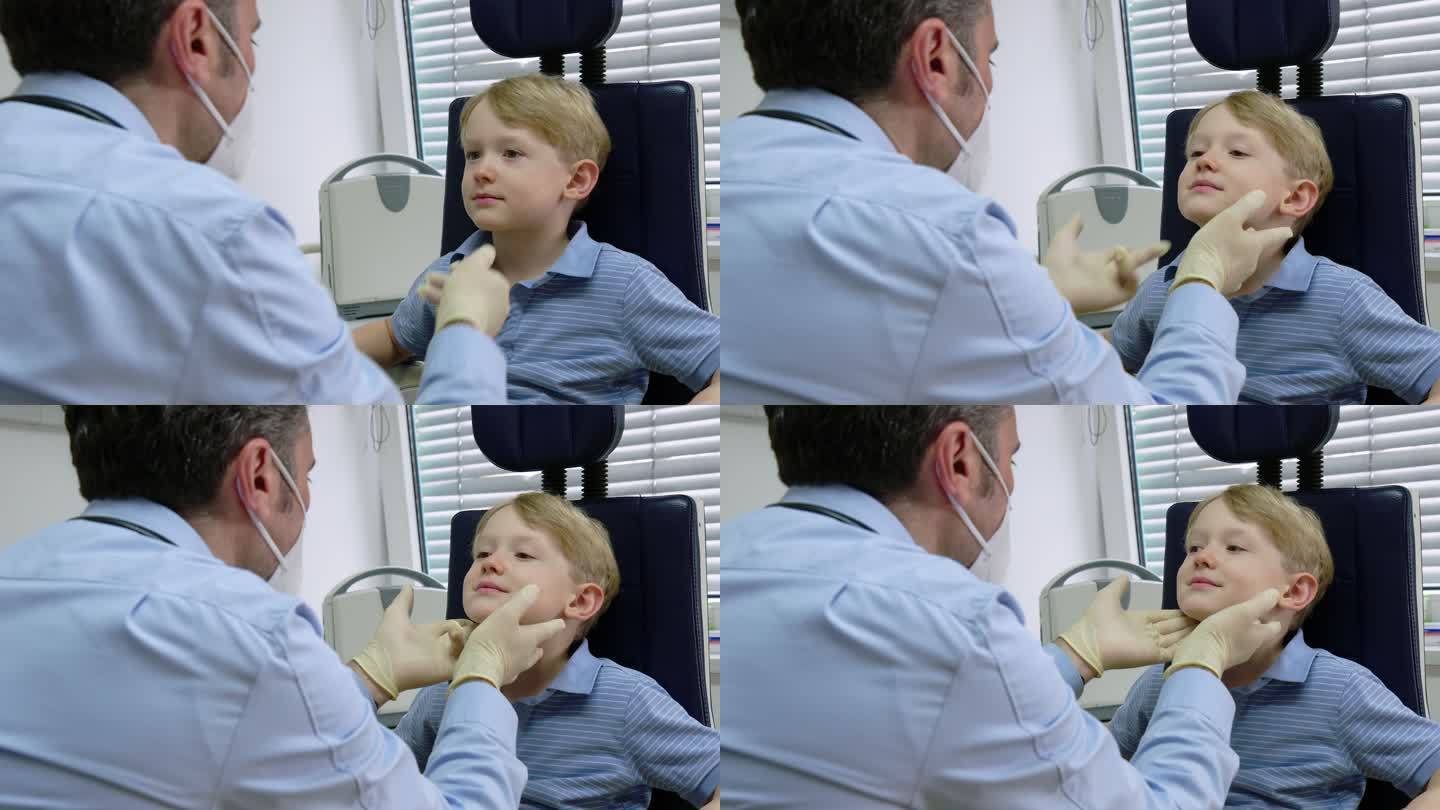 医生检查小病人的颈部