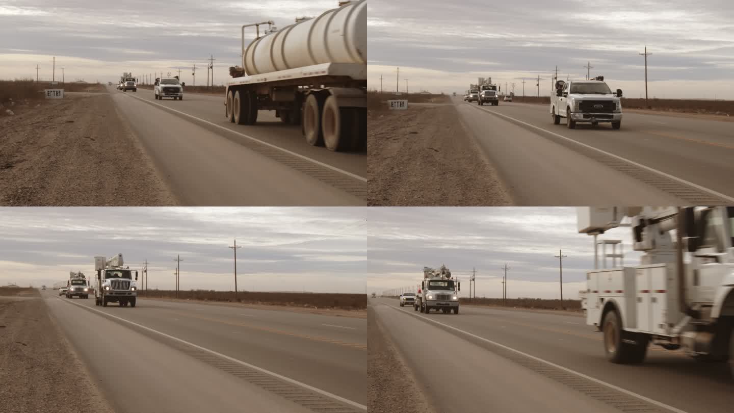 带集装箱拖车的白色半卡车在德克萨斯西部油田的公路上行驶