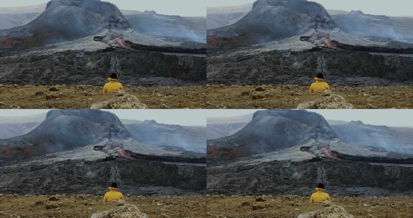 游客欣赏冰岛新火山爆发的风景