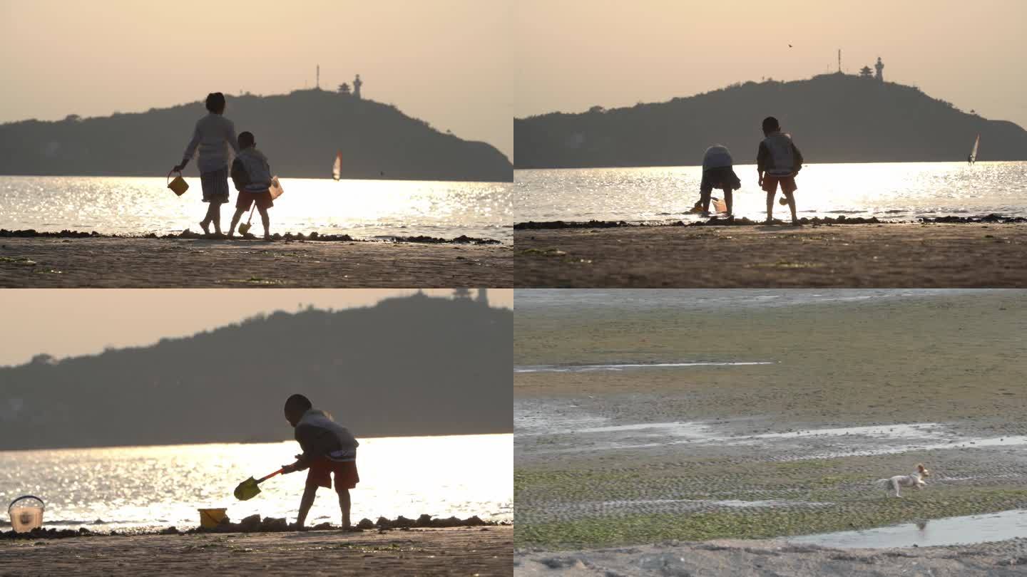 夕阳海边沙滩儿童嬉戏