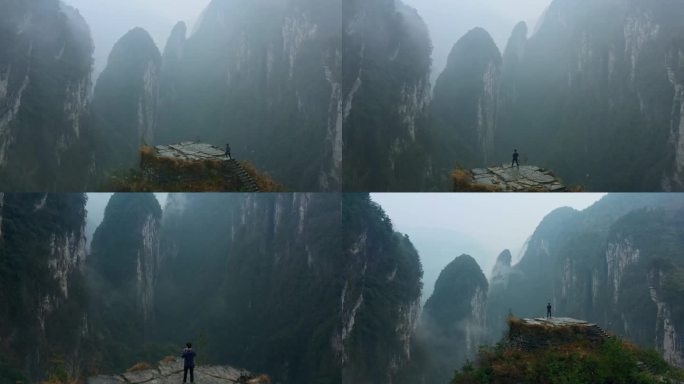 航拍一个人站在德夯大峡谷问天台上