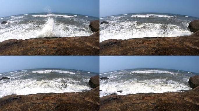 波浪撞击巨石海浪骇浪