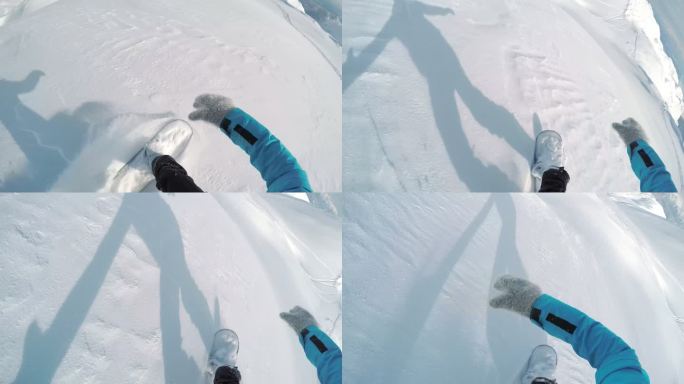POV阳光明媚的一天，在粉雪中滑雪
