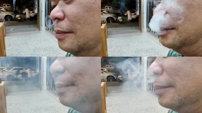 吸烟的男人局部特写忧虑嘴里吐出的烟雾失落