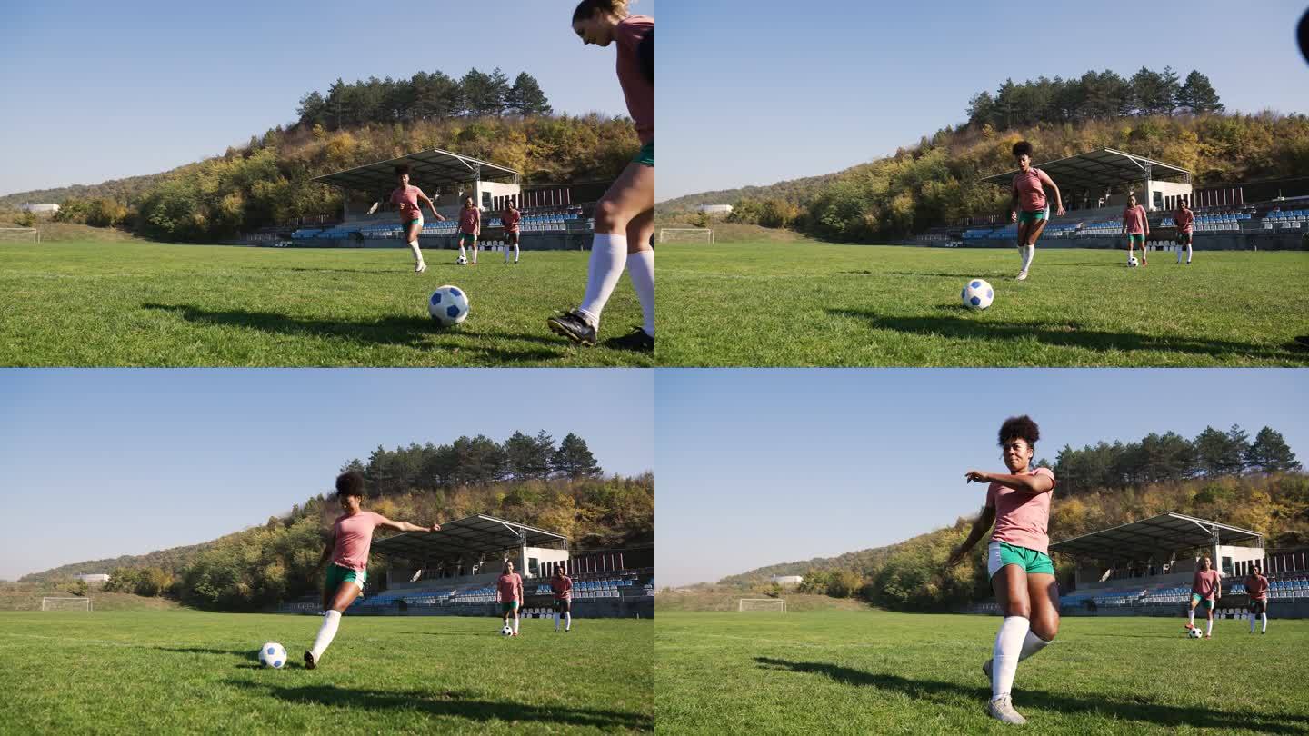 女子足球运动员玩球热身