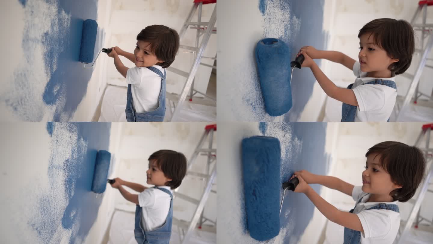 可爱的小男孩在家里用油漆滚筒画画，面带微笑