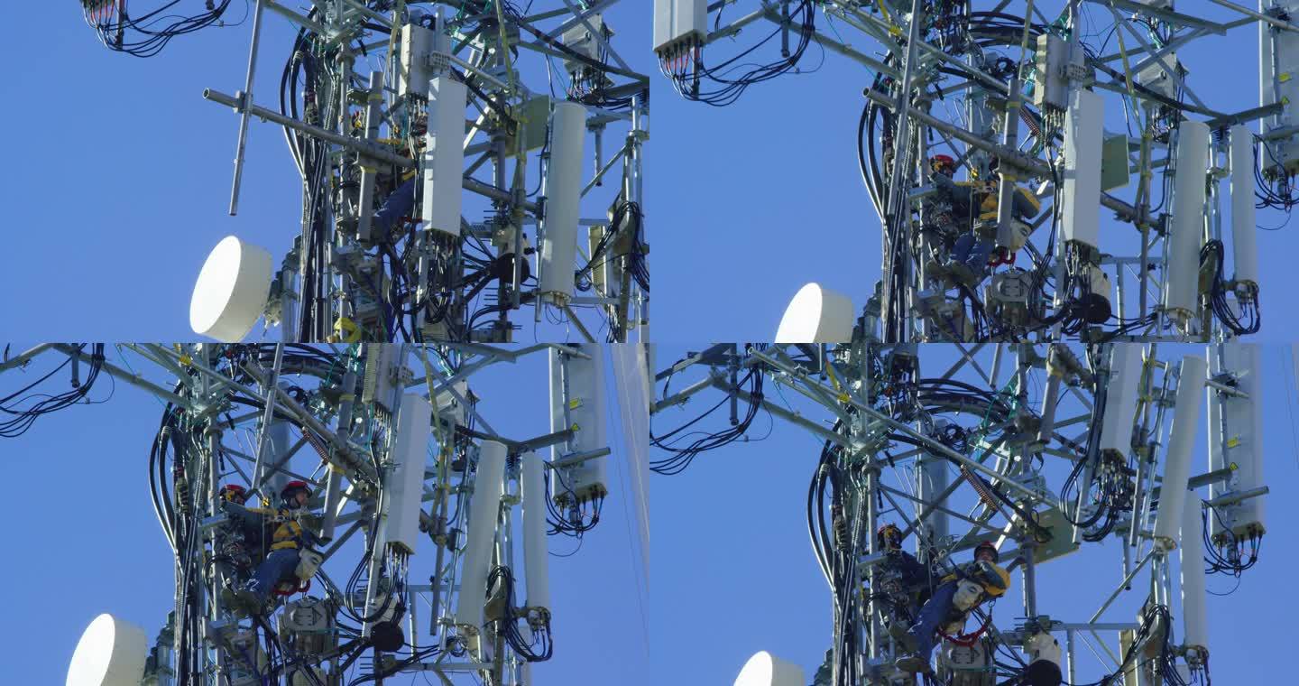 晴朗天气下一名技术人员组装手机塔的特写镜头