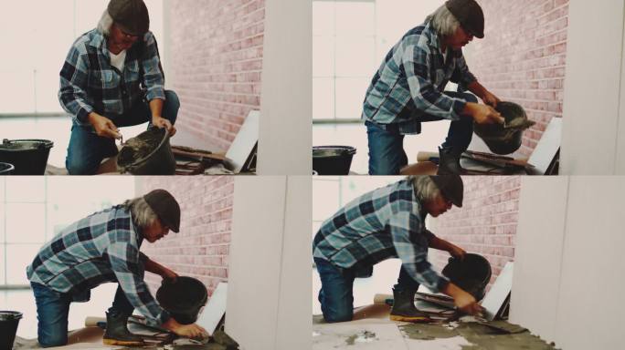 专业工人铺设瓷砖。