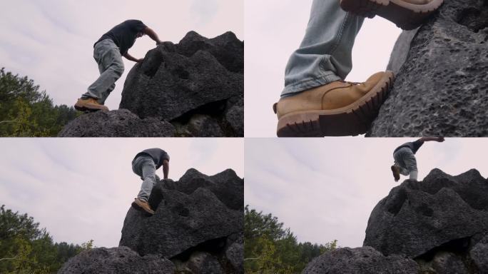 一个人男人 爬上悬崖峭壁 攀岩 登山