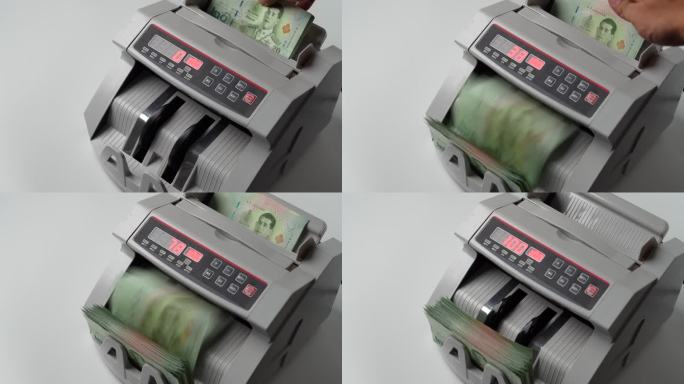 泰国银行钞票20泰铢在银行钞票计数器中计数的特写镜头，货币，计数，银行计数器，机器，纸币，金融市场概