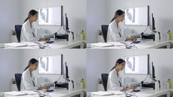 女医生在电脑键盘上打字