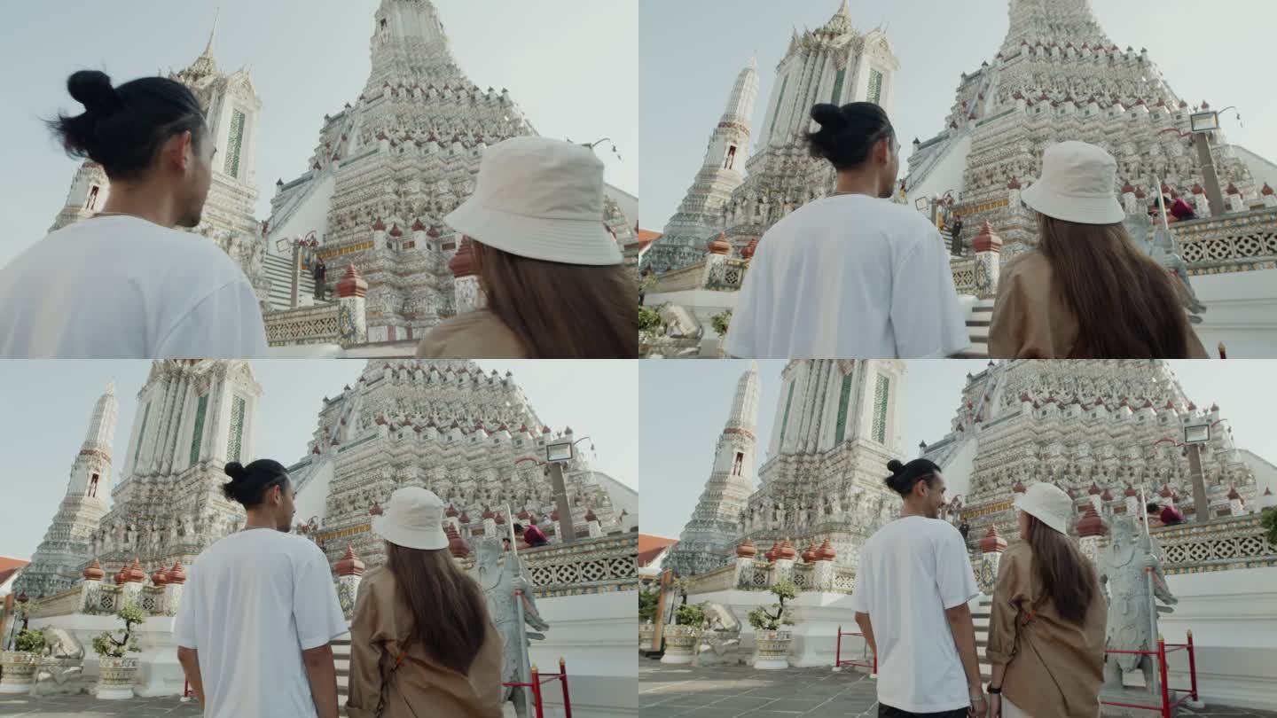 年轻夫妇前往泰国瓦特阿伦寺旅游。