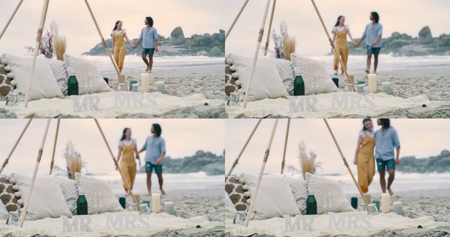 一对幸福的年轻夫妇求婚后在海滩上散步。一对相爱的男女，庆祝他们的订婚