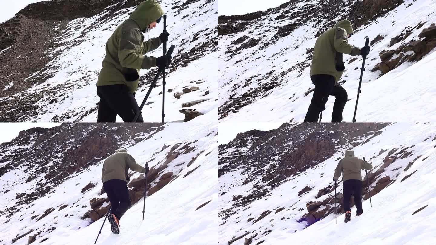 爬雪山 男子穿冲锋衣爬雪山 拄拐棍爬雪山