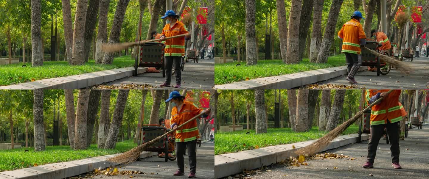 秋季马路边环卫工人扫落叶