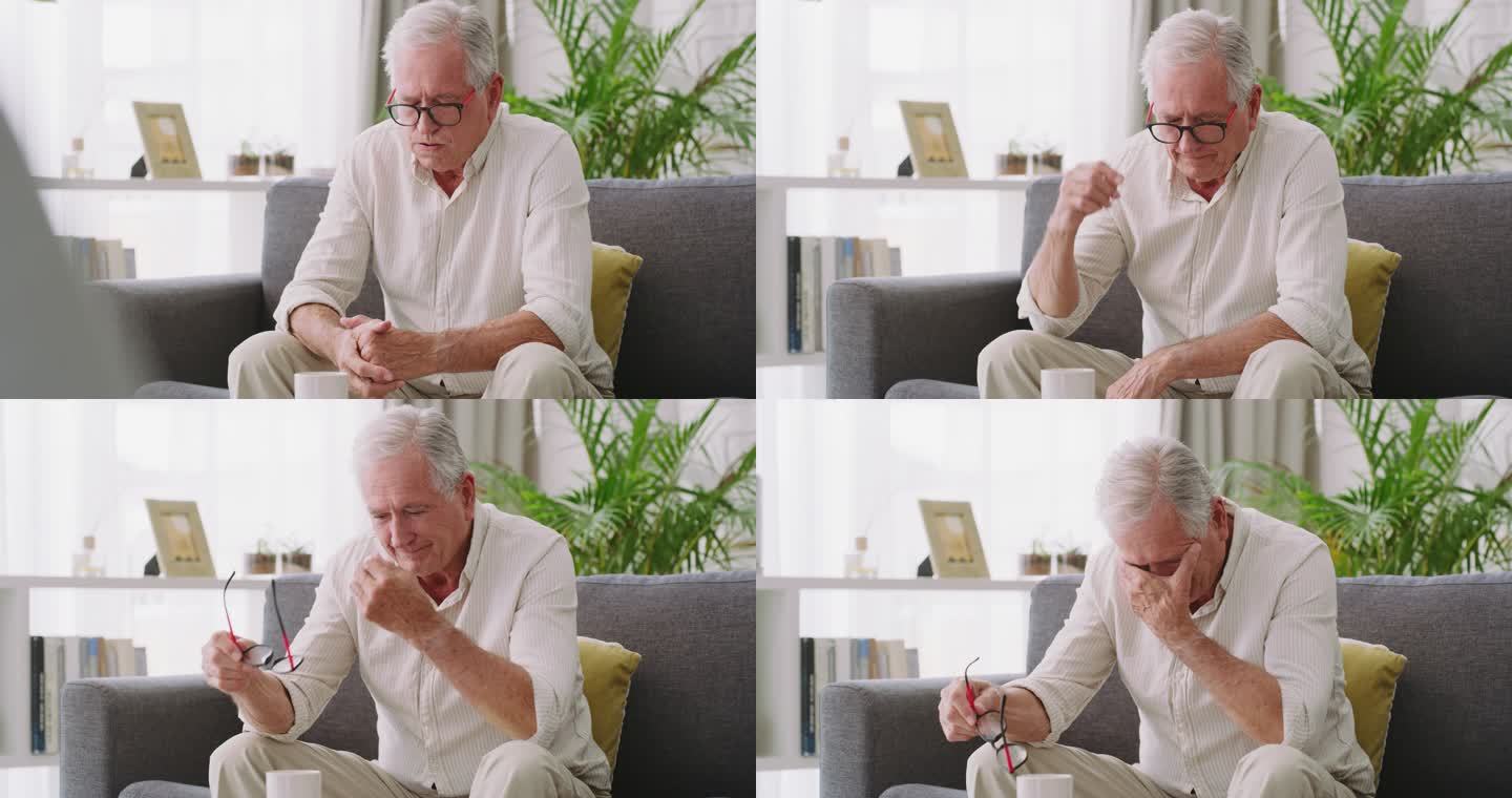 一位老人坐在沙发上，看起来在家里很紧张的4k视频片段