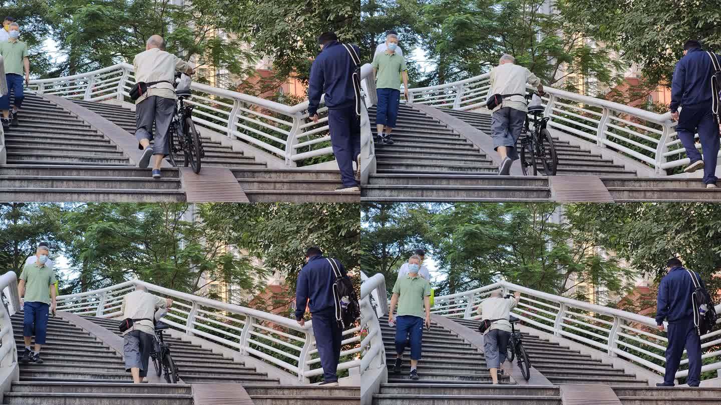 一个老人推自行车上天桥