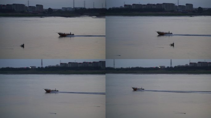 傍晚江上一只渔船驶过河面船只黄昏江河空境