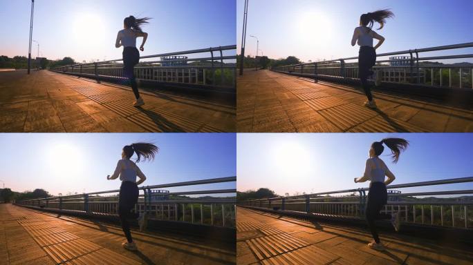 女孩逆光跑步女孩奔跑追光者户外阳光锻炼身