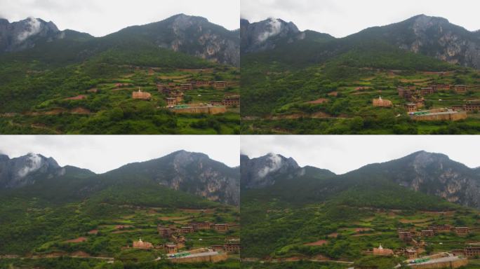 航拍远处高山上的村落