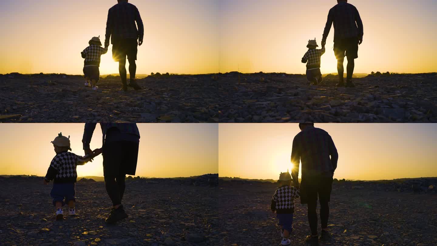 父子在日落黄昏时一起散步