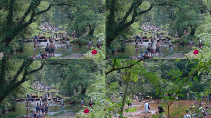 夏季大人小孩河里玩水玩水枪打水仗
