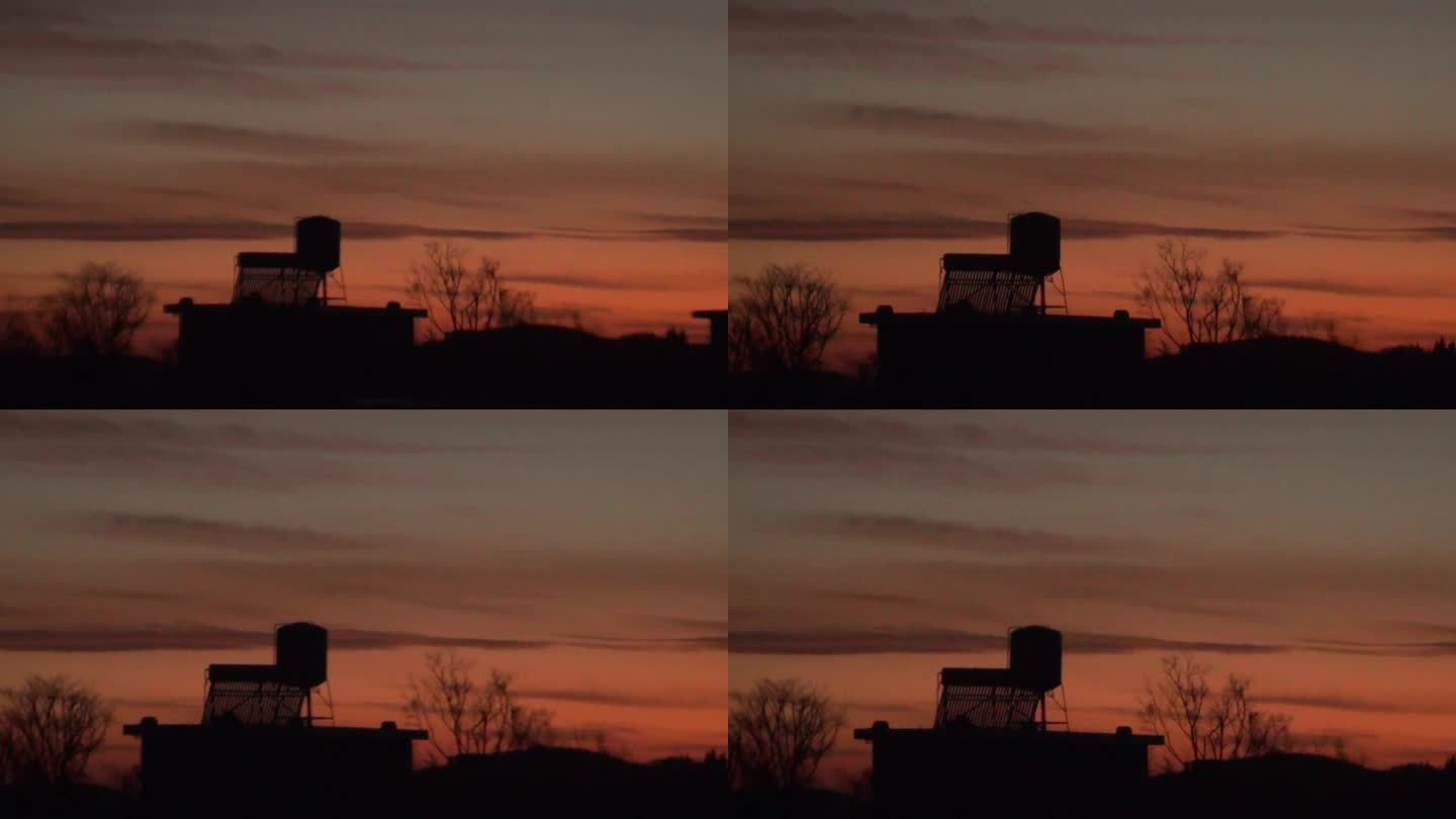 太阳落山日暮降临天空染成橘红色